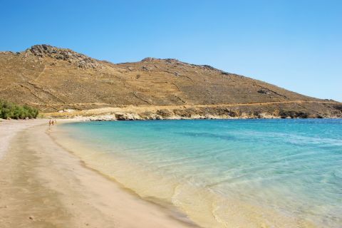 Mountainous cliffs and azure waters create a perfect scenery in Ganema beach