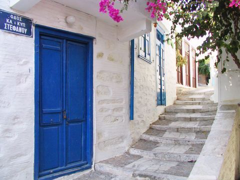 The blue door of a white house