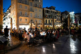 Night view of restaurants in a square of Corfu Town