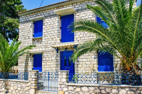 Beautiful, stone built construction with blue colored shutters.