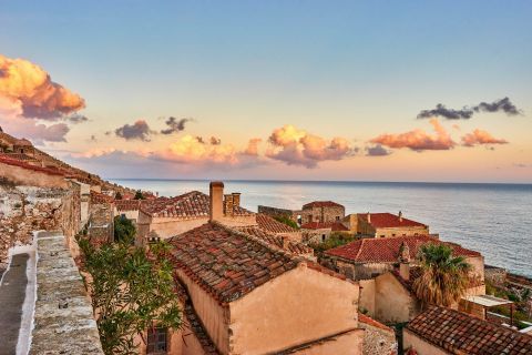 Traditional houses with chimneys and ceramic roof tiles