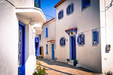 Whitewashed houses with blue colored details, Skiathos